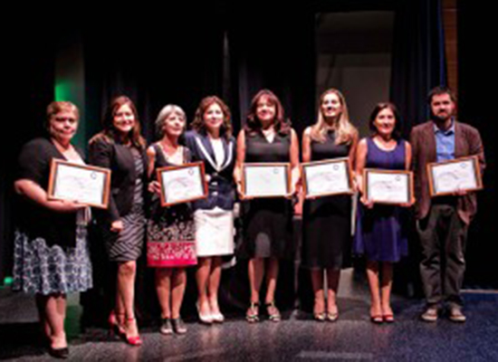 MenCare Chile's staff members accept awards for their fatherhood campaign from Comunidad Mujer in honor of International Women's Day