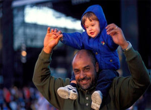 Child on Father's Shoulders