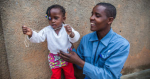 A man and his daughter in Rwanda. Photo by Perttu Saralampi.